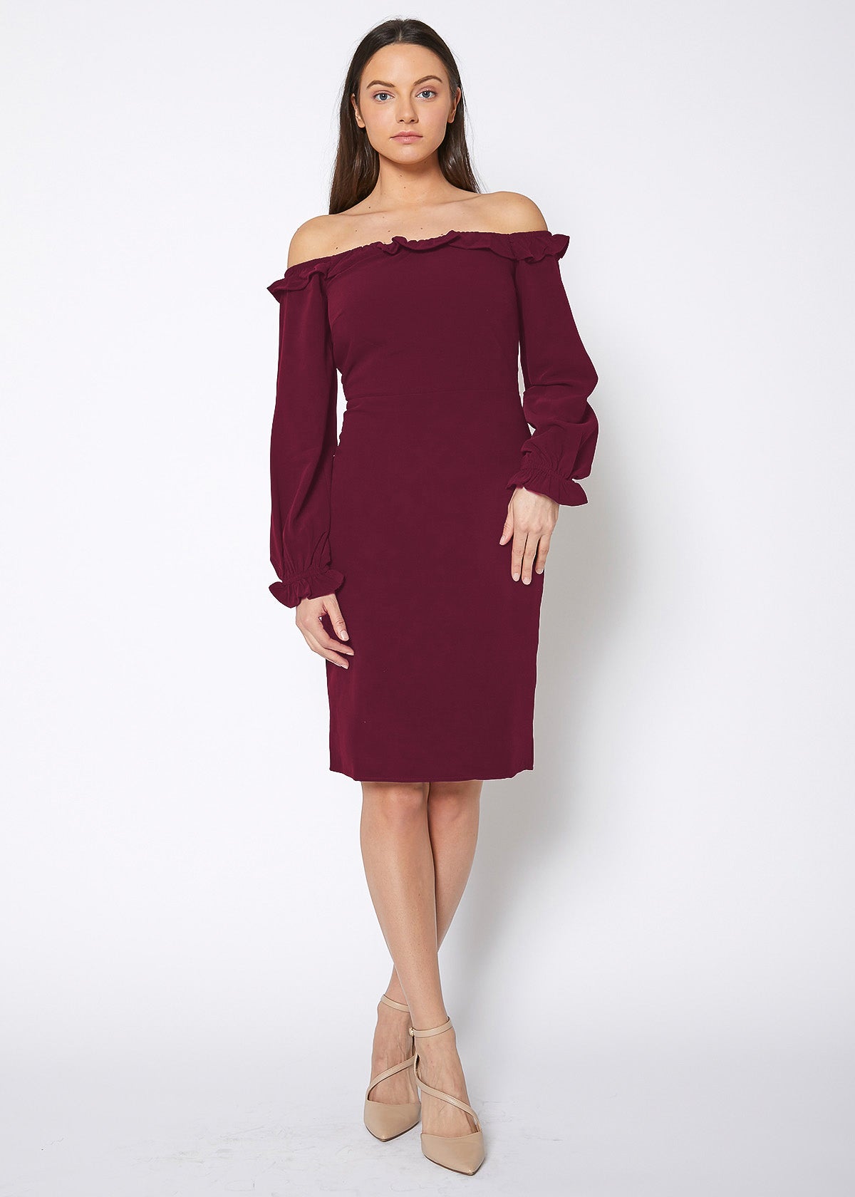 Woman wearing a burgundy off-shoulder dress on a white background