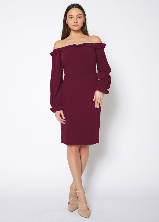 Woman wearing a burgundy off-shoulder dress on a white background