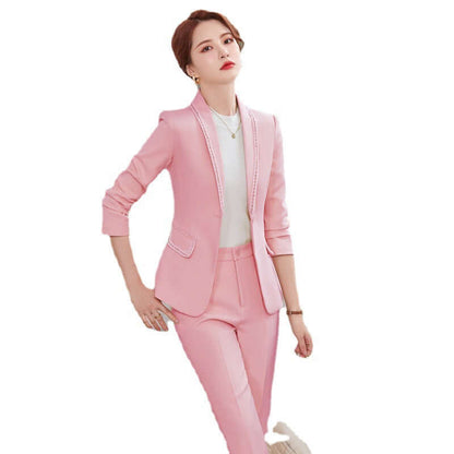 Woman wearing a pink suit on a white background