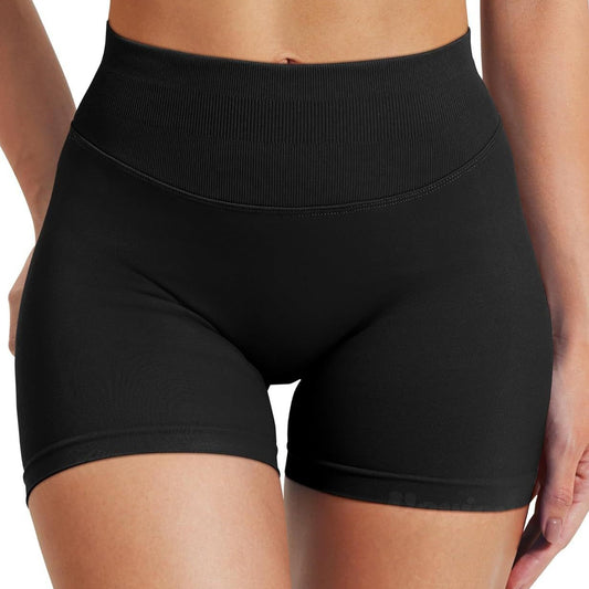 Black high-waisted shorts worn by a woman on a white background