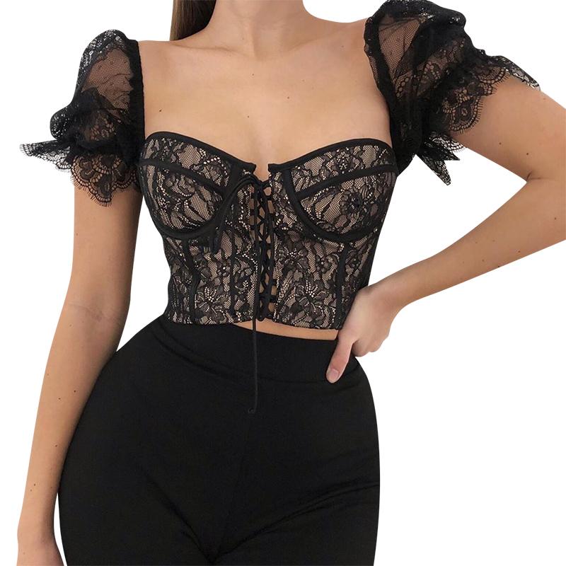 Black lace top worn by a model on a white background