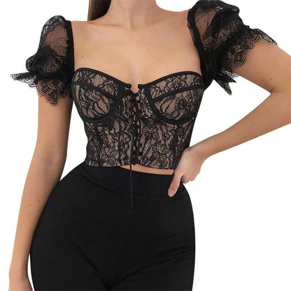 Black lace top worn by a model on a white background